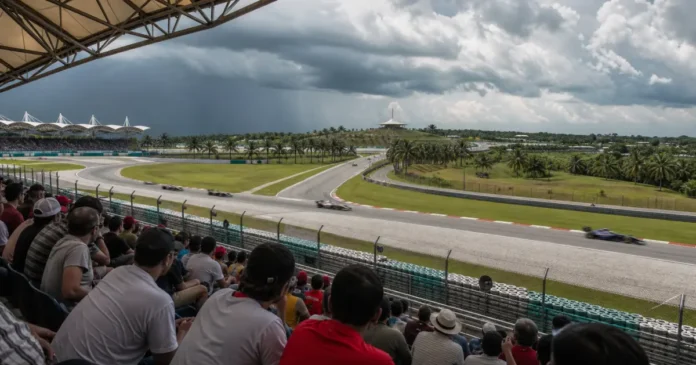 Spectators watching race cars at Sepang Circuit beneath tropical storm clouds